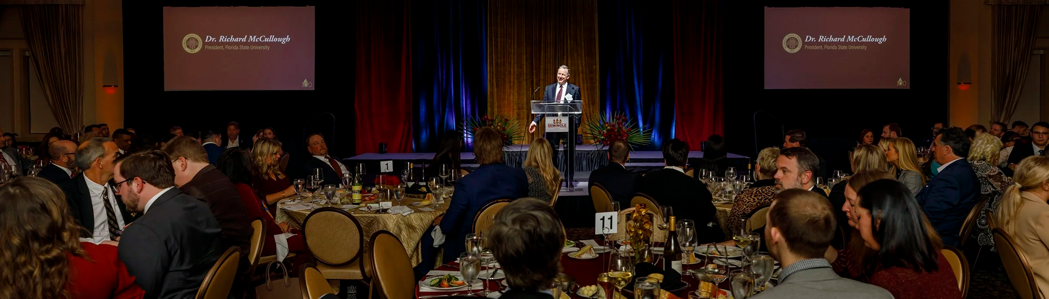 A photo of President Richard McCullough speaking at the Seminole 100 Awards ceremony