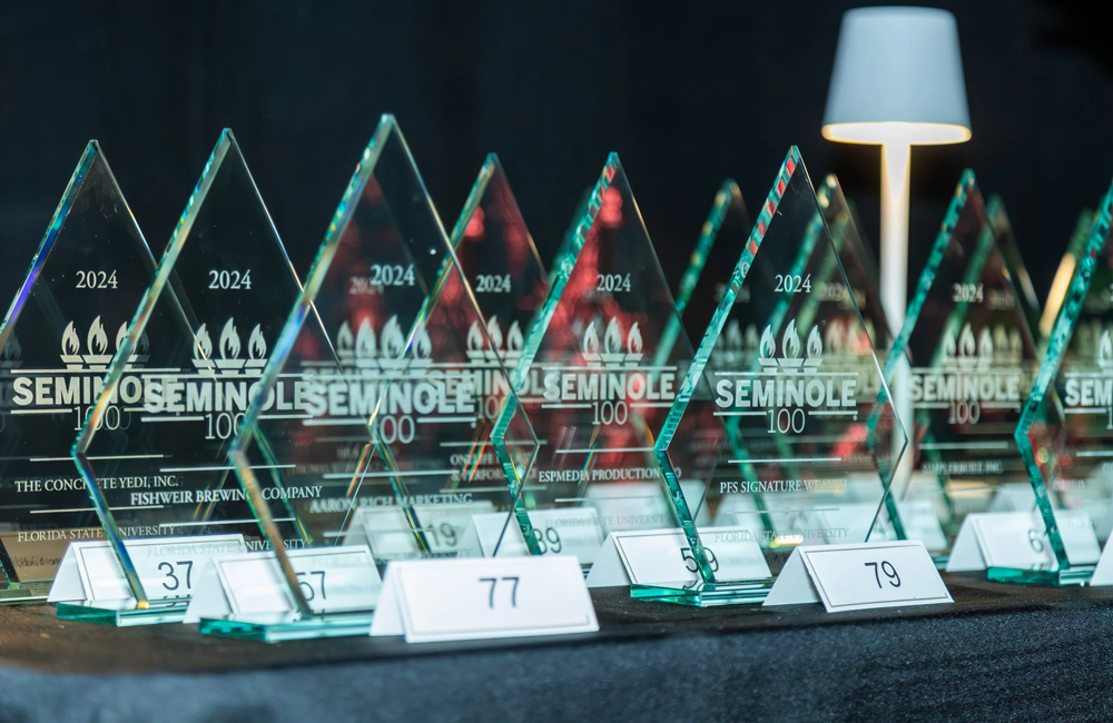 A row of glass Seminole 100 awards