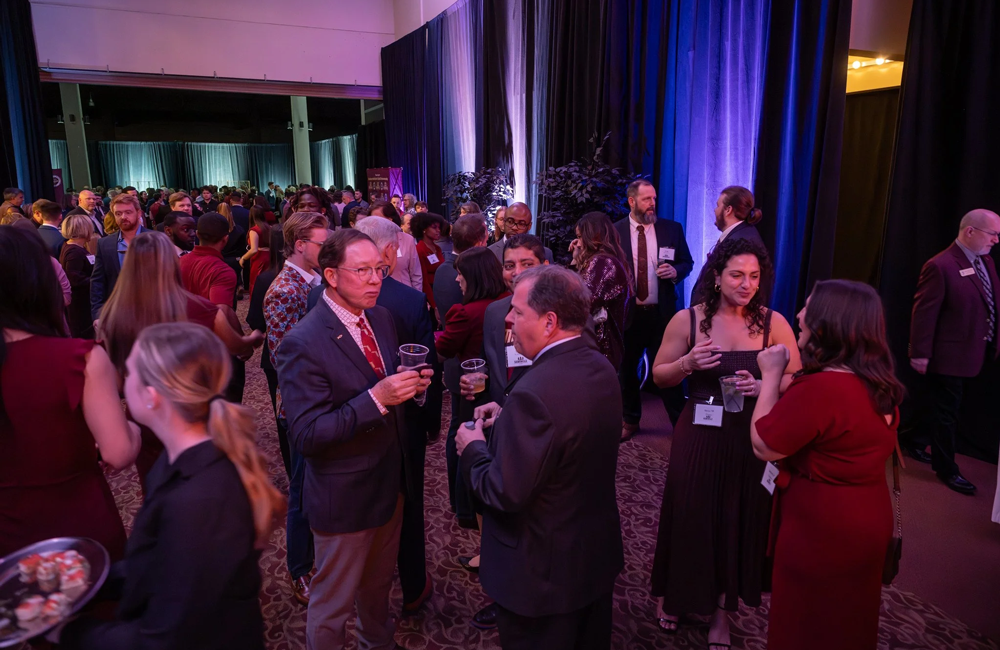 Guests of the Seminole 100 celebration standing and mingling